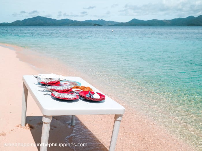 picnic on the beach on a coron boat tour