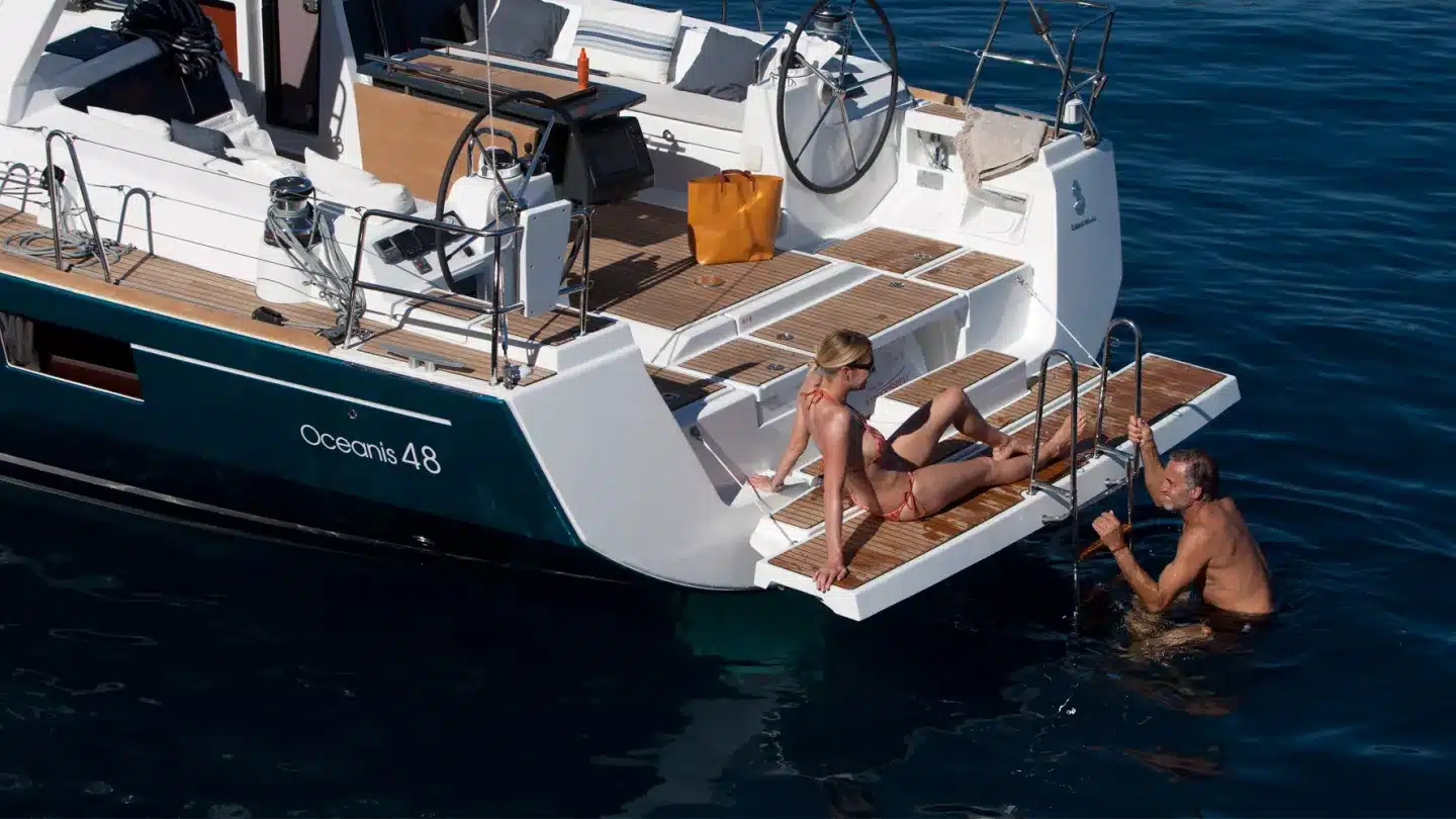 coron yacht sun tanning on deck