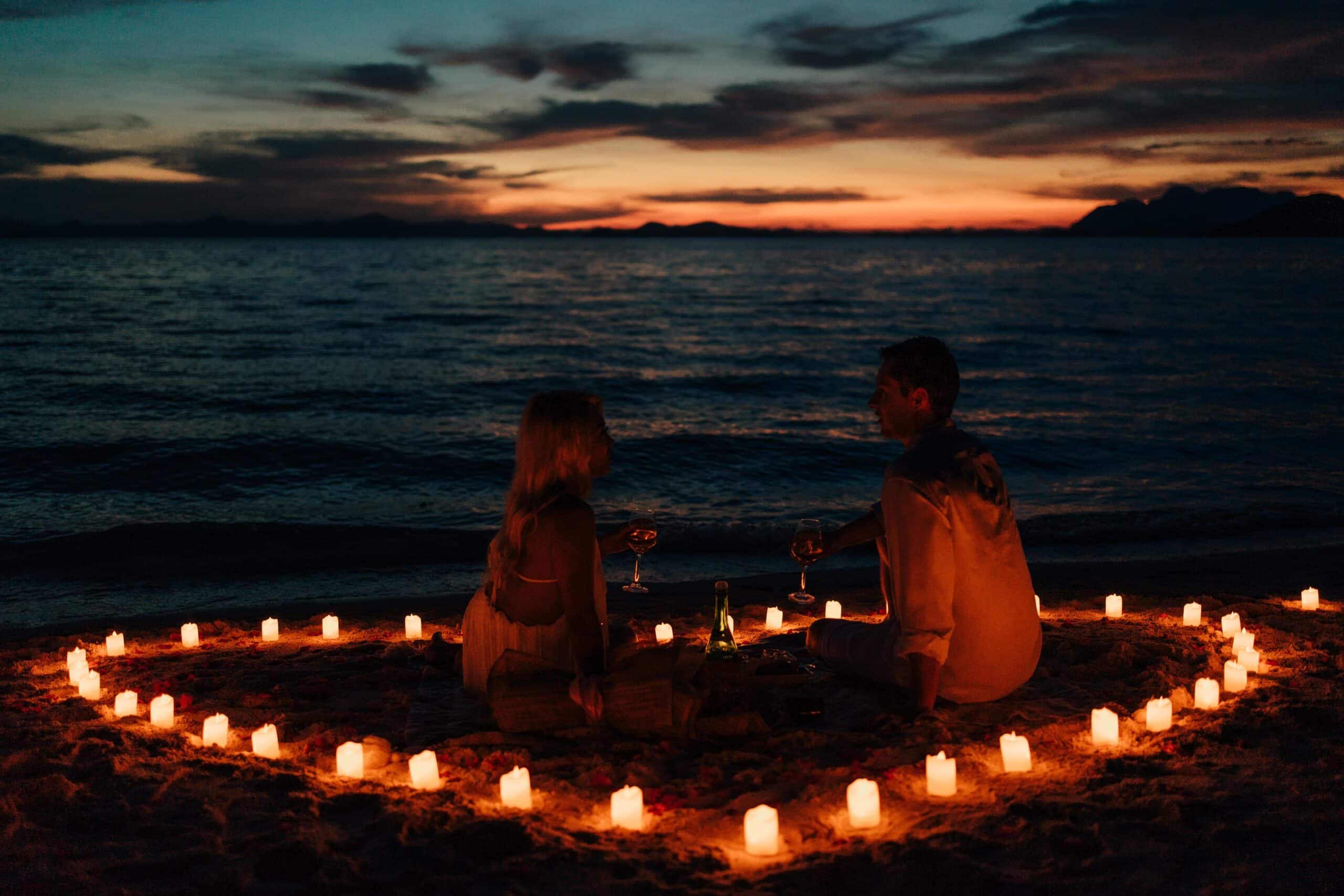 Sunset-romantic-candle-rose-petals-coron-wedding-proposal-package- skeleton wreck