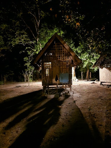 linapacan tourist camp hut at night