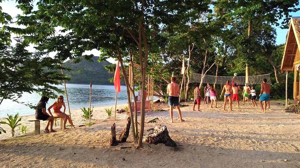linapacan tourists camp volleyball on beach