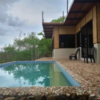 Seaside villa with private pool and outdoor seating in Coron, Philippines. Perfect for relaxing isla.