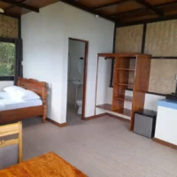 Comfortable island accommodation with a wooden bed and basic amenities in Coron, Philippines. Perfec.