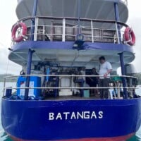Dolphin Liveaboard boat docked in Batangas for island hopping and diving trips.