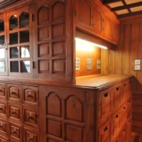 Wooden cabinetry and storage units inside Siren Liveaboard vessel.