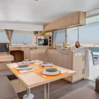 A bright, modern dining space with a view of the ocean, perfect for relaxing meals during your Phili.