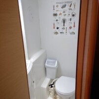 Bathroom with educational marine life poster.