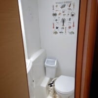 Bathroom with educational marine life poster.