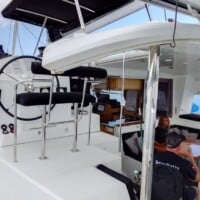 Modern yacht interior with seating and navigation area for island hopping tours in the Philippines.
