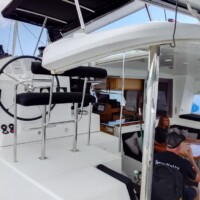 Modern yacht interior with seating and navigation area for island hopping tours in the Philippines.